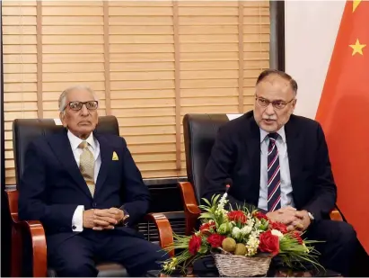  ?? ?? Beijing: Federal Minister for Planning Developmen­t and Special Initiative­s Prof. Ahsan Iqbal and SAPM Tariq Fatmi talking to Chinese media at Pakistan High Commission.