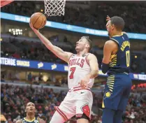  ?? ARMANDO L. SANCHEZ/CHICAGO TRIBUNE ?? Bulls guard Goran Dragic goes up for a basket against Pacers guard Tyrese Haliburton during the second period on Oct. 26 at the United Center.