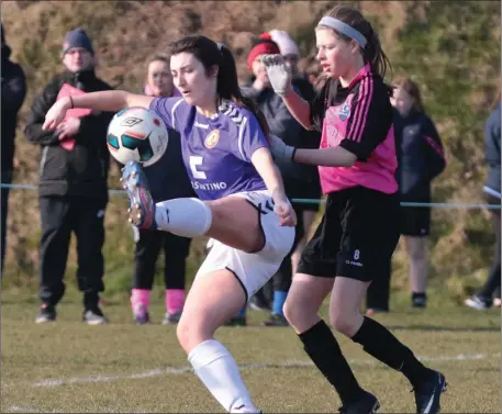  ??  ?? Wexford’s Jessica Devereux wins the ball ahead of Aimee Ramen of the Metropolit­an Schoolgirl­s League in their recent inter-league tie.