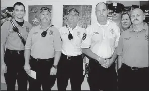  ??  ?? North Little Rock firefighte­rs B.C. Miller, C.W. Platt,
Capt. R. Gunther, J.A. Hooks and D.W. Free