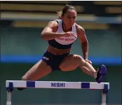  ??  ?? QUITE A HURDLE: Ennis-Hill is put through her paces at her training camp in Fukuoka, Japan