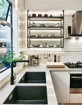  ??  ?? THIS PAGE Restaurant-style shelving by Kitchens By Design gives this kitchen a hard-working, homely feel; open shelving is best for those with a tendency to be tidy – and they’ll need dusting.