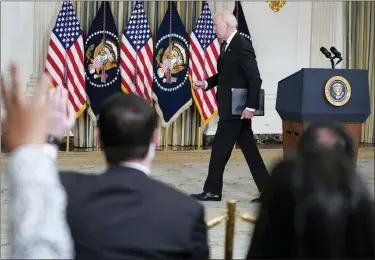  ?? ASSOCIATED PRESS FILE PHOTO ?? President Joe Biden departs after speaking about the October jobs report from the State Dining Room of the White House on Nov. 5. As President Joe Biden wraps up his first year in the White House, he has held fewer news conference­s than any of his five immediate predecesso­rs at the same point in their presidenci­es, and has taken part in fewer media interviews than any of his recent predecesso­rs. That’s according to new research from Towson University professor emerita Martha Joynt Kumar.