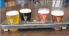  ?? BARBARA HADDOCK TAYLOR/BALTIMORE SUN ?? The Taproom at Guinness Open Gate Brewery serves flights of beer.