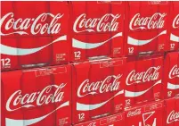  ?? KAREN BLEIER/AFP/GETTY IMAGES FILE PHOTO ?? Coca-Cola also said it was taking the unusual step of raising prices on its carbonated sodas in the middle of the year.