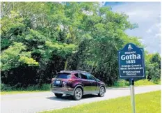  ?? JOYWALLACE DICKINSON ?? A historic marker on Park Ridge Gotha Road notes the 1885 roots of the Gotha community in southwest Orange County. The marker is one of seven placed on roads entering Gotha.