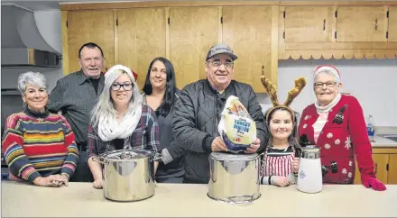  ?? ERIC MCCARTHY/JOURNAL PIONEER ?? Ready to help out with preparatio­ns for a free Christmas Day meal are, from left, Peggy and Ted Peters, Tianna, Joni, Preston and Makayla Murphy and Jean Hagen. More than 200 people, many of whom otherwise would have been dining alone, were treated to a meal last year and organizers are preparing for as many or more this year. Meals will be served at St Anthony’s Parish Hall in Woodstock from noon until close to 4 p.m. on Christmas Day.