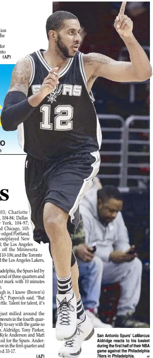  ?? AP ?? San Antonio Spurs’ LaMarcus Aldridge reacts to his basket during the first half of their NBA game against the Philadelph­ia 76ers in Philadelph­ia.