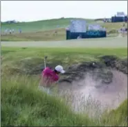  ?? CHRIS CARLSON — THE ASSOCIATED PRESS ?? Jason Day hits from a bunker on the ninth hole.