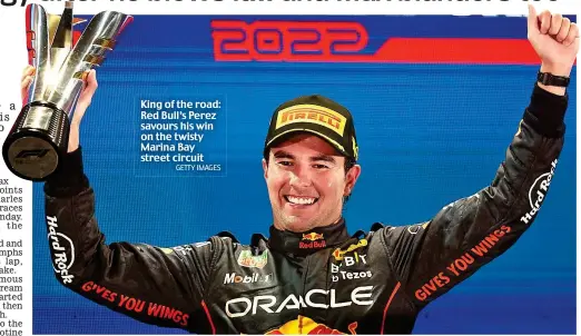  ?? GETTY IMAGES ?? King of the road: Red Bull’s Perez savours his win on the twisty Marina Bay street circuit