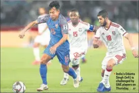  ?? AP ?? India's Udanta Singh (left) is challenged by UAE players on Thursday.