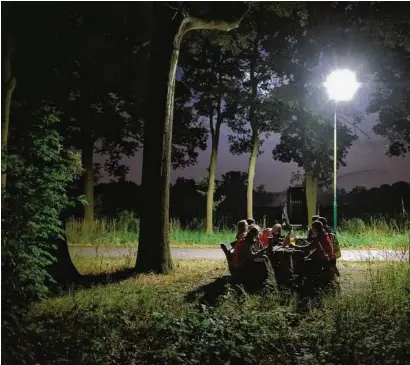  ?? Photos by Dmitry Kostyukov / New York Times ?? Children participat­e in a Dutch tradition known as “dropping,” where youngsters left in a forest have to find their way back to base.