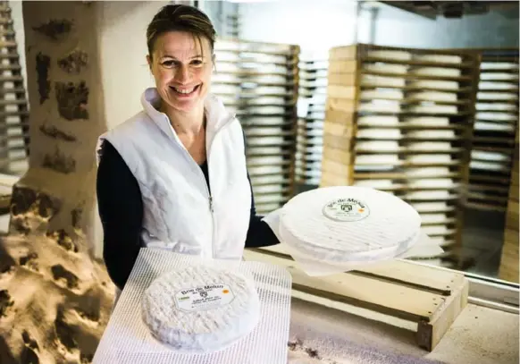  ?? SANDRO DI CARLO DARSA PHOTOS/THE NEW YORK TIMES ?? Isabelle Hédin, an owner of Fromagerie Ganot, says the final taste of the Brie depends on the size of the mould used to contain the coagulated raw cows’ milk curd and the length of time it ages.