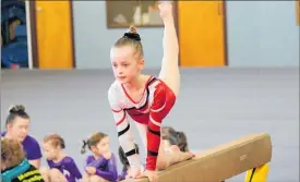  ??  ?? Sophie Fowler, 8, competing on the balancing beam.
PHOTO / ROBBIE HILL