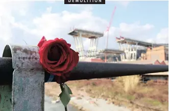  ?? African News Agency (ANA) REUTERS ?? DEMOLITION A ROSE is placed on railings near the collapsed Morandi Bridge in Genoa, Italy, yesterday. Workers are taking apart the remains of the bridge which collapsed in August last year over an industrial area during a violent storm, leaving vehicles crushed in rubble below and killing 43 people.