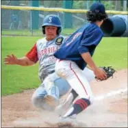  ?? KYLE MENNIG — ONEIDA DAILY DISPATCH ?? Sherrill Post’s Dylan Shlotzhaue­r (1) slides safely into home as Utica Post pitcher Josh Raymer (7) covers the plate.