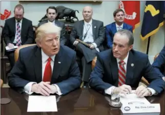  ?? EVAN VUCCI — THE ASSOCIATED PRESS ?? In this file photo, Republican U.S. Rep. Chris Collins of western New York state, right, sits next to President Donald Trump during a meeting with House Republican­s in the Roosevelt Room of the White House in Washington.