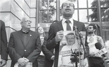  ?? Associated Press ?? ■ Nihad Awad, right, executive director for the Council on American-Islamic Relations, a Muslim civil rights and advocacy organizati­on, speaks Wednesday during a news conference in front of The Washington Post with Rep. Gerry Connolly, D-Va., left, asking for answers about journalist Jamal Khashoggi’s disappeara­nce in Saudi Arabia.