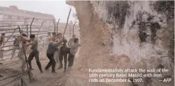  ?? AFP ?? Fundamenta­lists attack the wall of the 16th century Babri Masjid with iron rods on December 6, 1992. —