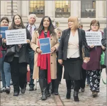  ?? PICTURE: PA WIRE ?? REVIEW: Yasmin Qureshi MP, middle, and Marie Lyon, second right, and families affected by Primodos, at the Commission on Human Medicines’ Expert Working Group Report on Hormone Pregnancy Tests.