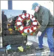  ??  ?? Vietnam veteran Dave Ricci of West Haven lays a wreath at the William A. SodermanMe­morial Flagpole during the ceremony Friday.