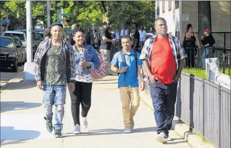  ?? Photograph­s by Francisco Roman TBS ?? TRAY (Tracy Morgan, right) goes for a stroll with Bobby (Allen Maldonado, left) and his twins (Taylor Mosby and Dante Hoagland).