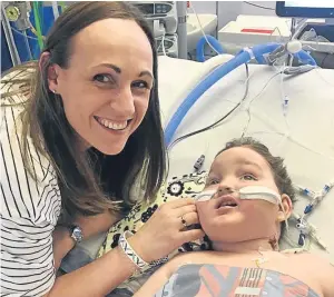  ??  ?? Jenny McMillan with son Blake, who has a rare illness and cannot walk, talk or eat. The young battler could be transferre­d to Ninewells next week after treatment in Edinburgh.