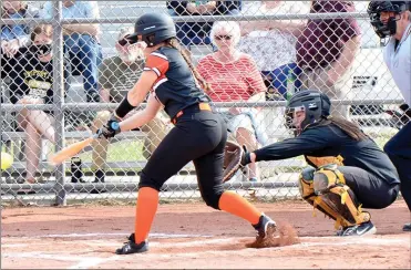  ?? PILOT PHOTO/RON HARAMIA ?? Culver’s Abbi Kisela gets an RBI on this hit during the Lady Cavaliers’ game with Argos Tuesday. Catching for Argos is Carleigh Miller.