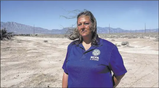  ?? Rachel Aston Las Vegas Review-Journal @rookie__rae ?? Ginger Stumne, the public administra­tor for Nye County, stands April 12 outside a Pahrump home for which she will soon finish escrow.