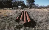  ??  ?? Remains of an old pipeline already litter the land of the historic Hershey Ranch in Stonewall.