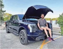  ?? PROVIDED BY DAMON LINDSEY ?? Ken Stepps, 42, of Wheaton, Ill., is a sustainabl­e landscape designer and handyman who picked up his Ford F-150 Lightning two days before his birthday in May. He is sitting in the front trunk, known as a frunk.