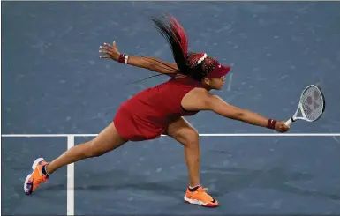  ?? SETH WENIG, FILE — THE ASSOCIATED PRESS ?? Naomi Osaka, of Japan, reaches for a shot by Marketa Vondrousov­a, of the Czech Republic, during the third round of the tennis competitio­n at the 2020Summer Olympics, in Tokyo, Japan.