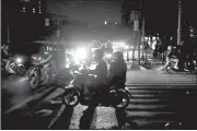  ?? AP/DITA ALANGKARA ?? Motorists navigate through traffic during Sunday’s blackout in Jakarta, Indonesia.