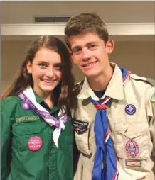  ?? The Associated Press ?? Sydney Ireland, left, stands with her bother, Bryan, who is an Eagle Scout, at a National Organizati­on for Women conference in Washington last summer. Sydney is an unofficial member of her brother’s troop, but can not earn merit badges to start on the...