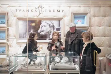  ?? Bryan R. Smith AFP/Getty Images ?? A DISPLAY at the Ivanka Trump store in New York. Her line of women’s merchandis­e sold well during 2016 as the presidenti­al election took shape. As her brand got pulled into the polarizing political debate, sales fell off.