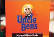  ??  ?? The portrait of ‘Uncle Ben’s’ is portrayed on a box of rice on June 18, 2020, in Jackson,
Miss. The Uncle Ben’s rice brand is getting a new name: Ben’s Original. (AP)
