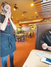  ?? Screenshot ?? Tipping Yuba-sutter Counties members Eric and Marissa Quintana give a $500 tip to a server at Dancing Tomato Caffé in Yuba City on Jan. 8.