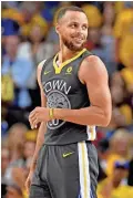  ??  ?? Warriors guard Stephen Curry reacts during the fourth quarter against the Cavaliers in Game 2 of the NBA Finals at Oracle Arena on Sunday.