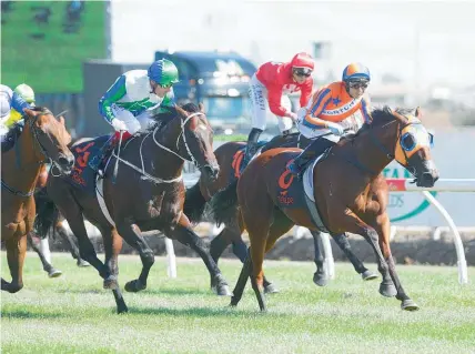  ?? Photo / Trish Dunell ?? Melody Belle (right) snatches victory in a desperate finish at Te Rapa.