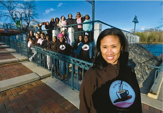  ?? KENNETH K. LAM/STAFF ?? Patrice West, right, President of Mocha Moms’ Howard County Chapter, poses for a picture with other members at Columbia’s Lakefront.