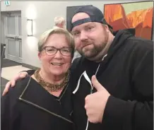  ?? JAMES MILLER/The Okanagan Weekend ?? Candidate Judy Sentes gets a hug from Ryan Graham, president of the Downtown Business Associatio­n, at the Penticton Herald’s all-candidates forum for city council hopefuls Thursday at the Penticton Lakeside Resort.