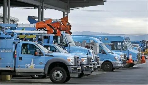  ?? BEN MARGOT — THE ASSOCIATED PRESS FILE ?? Pacific Gas & Electric vehicles are parked at the PG&E Oakland Service Center in Oakland Pacific Gas & Electric on Monday, March 16, 2020, won court approval to raise $23billion to help pay its bills over destructiv­e California wildfires after Gov. Gavin Newsom dropped his opposition to a financing package designed to help the nation’s largest utility get out of bankruptcy.