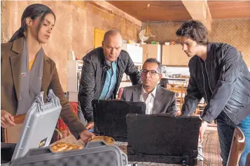  ?? COURTESY OF CHRISTIAN BLACK/LIONSGATE ?? From left, Shiva Negar, Michael Keaton, Neg Adamson and Dylan O’Brien in a scene from “American Assassin