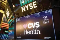  ?? MICHAEL NAGLE / BLOOMBERG 2017 ?? CVS Health Corp., as seen on New York Stock Exchange signage in December, raised $40 billion this week by selling debt to finance its takeover of health insurer Aetna.