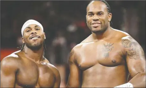  ??  ?? Shad Gaspard (right) teamed with JTG to form the Cryme Tyme tag team, which performed in WWE and had many matches against The Hart Dynasty. Gaspard, 39, died in May.