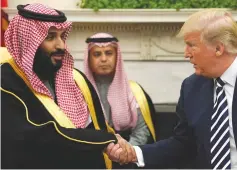  ?? (Jonathan Ernst/Reuters) ?? US PRESIDENT Donald Trump shakes hands with Saudi Arabia’s Crown Prince Mohammed bin Salman in the Oval Office at the White House earlier this year.