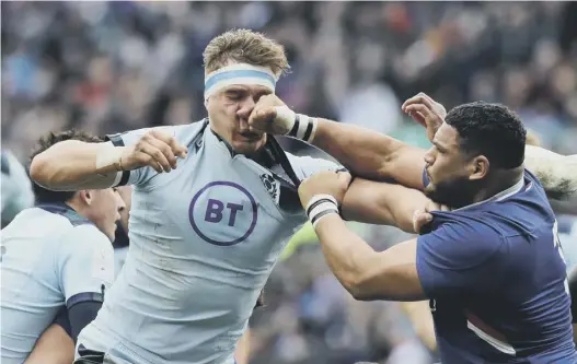  ??  ?? 0 Frenchman Mohamed Haouas was unlucky to be sent off for his punch on Scotland’s Jamie Ritchie, which was part of an ongoing scuffle.