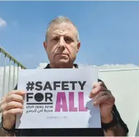  ?? (Israel Elwyn) ?? ISRAEL ELWYN CEO David Marcu holds a ‘Safety for All’ poster.