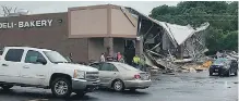  ??  ?? The Town and Country Supermarke­t in Hartville, Missouri, was hit by a tornado on Tuesday.