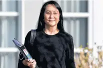  ?? JENNIFER GAUTHIER • REUTERS FILE PHOTO ?? Huawei Technologi­es chief financial officer Meng Wanzhou leaves her home to attend a court hearing in Vancouver, B.C. on March 22.